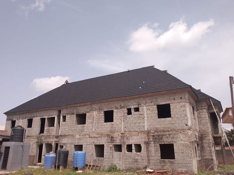 Roofed two-storey blockwork building awaiting plaster