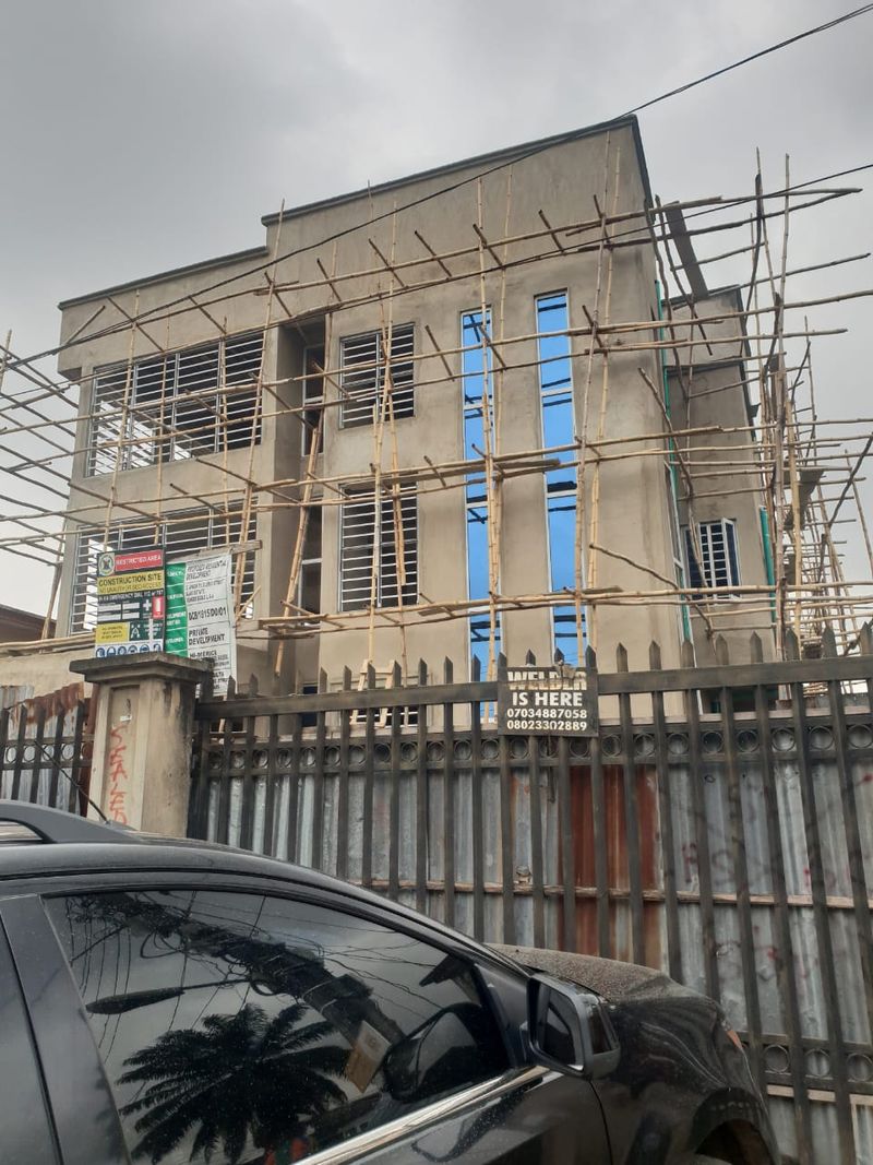 Three-storey facade with timber scaffolding