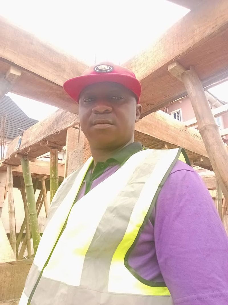 Team member under a timber roof frame